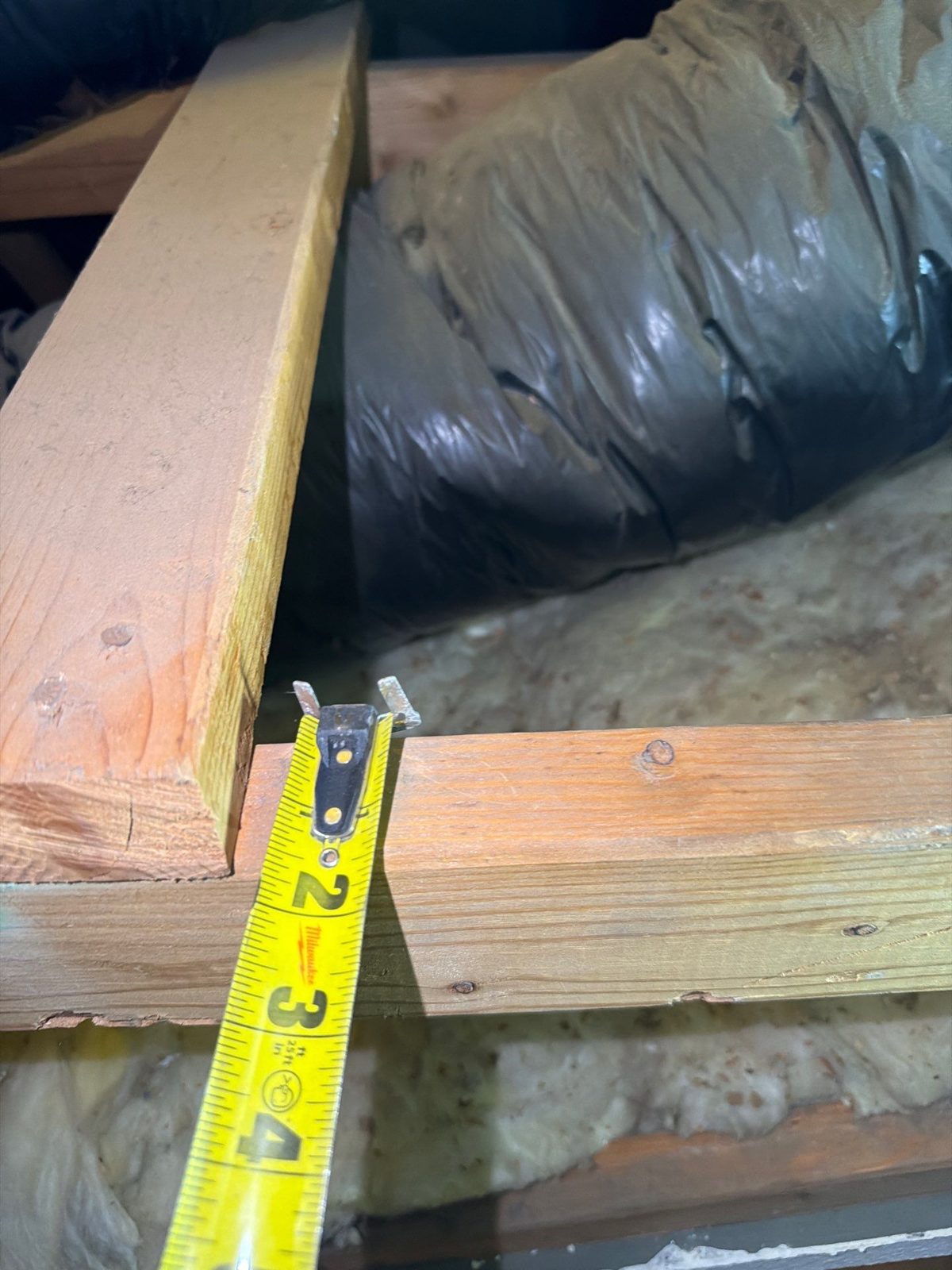 Tape measure on the face of a framing member