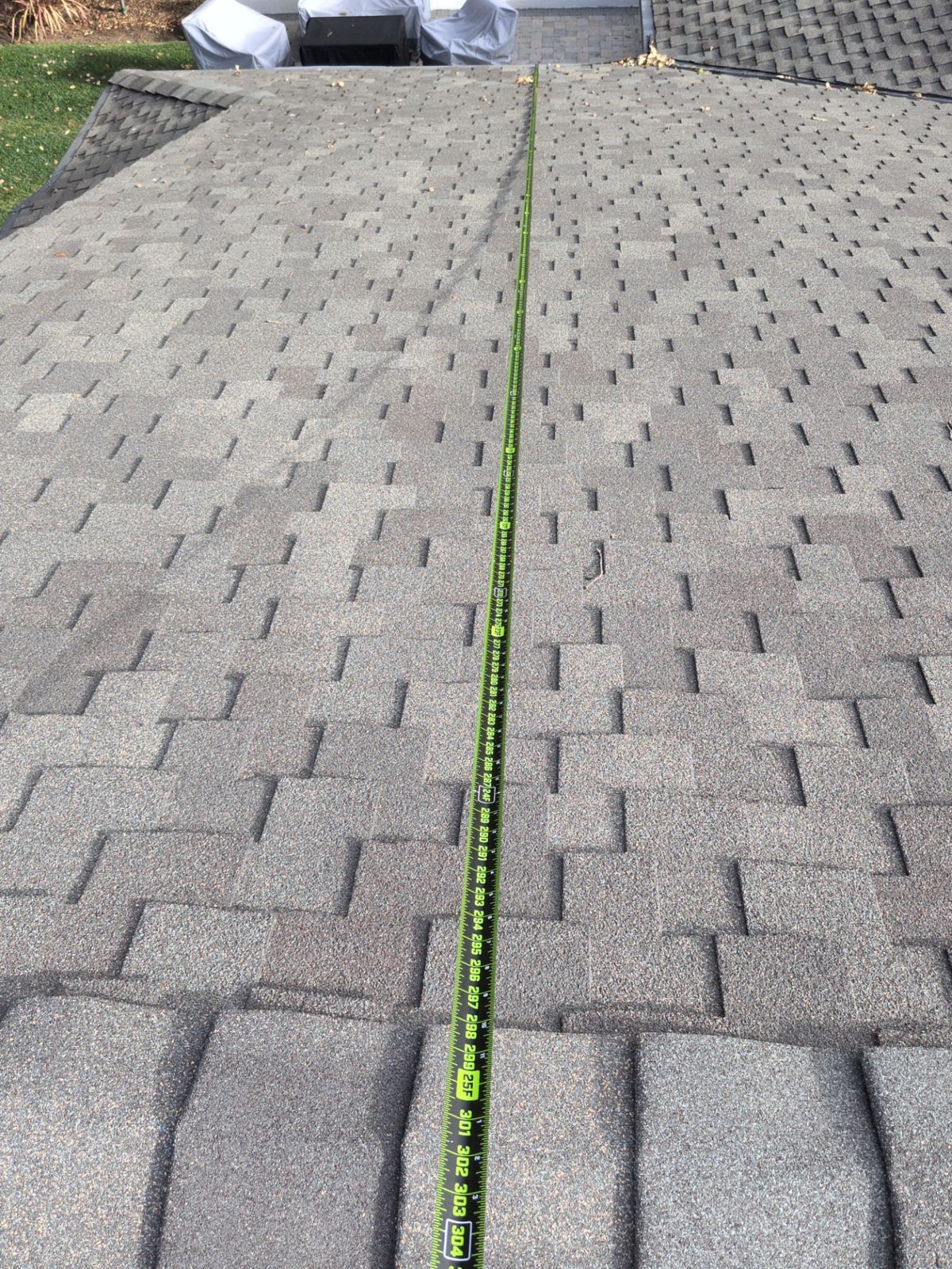 Tape measure run along a roof plane from eave to ridge